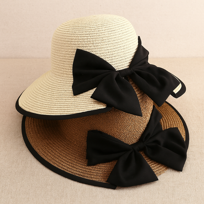 Overlapping straw hats with wide black ribbons and bow detailing, highlighting contrasting beige shades.