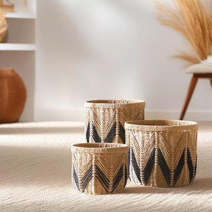 Three paper rope storage baskets with black chevron pattern in bright daylight interior space.