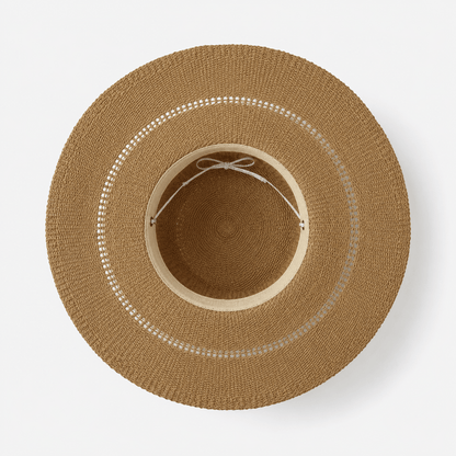Inside view of an adjustable wide brim paper straw sun hat showing the inner fit detail