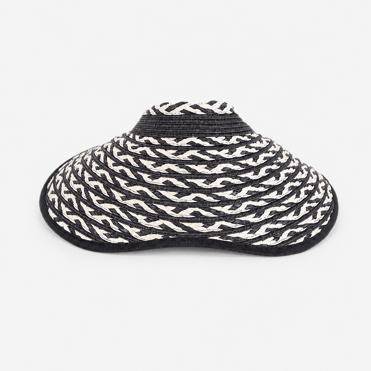 Black and white braided wide brim paper straw visor hat for women in a front product view