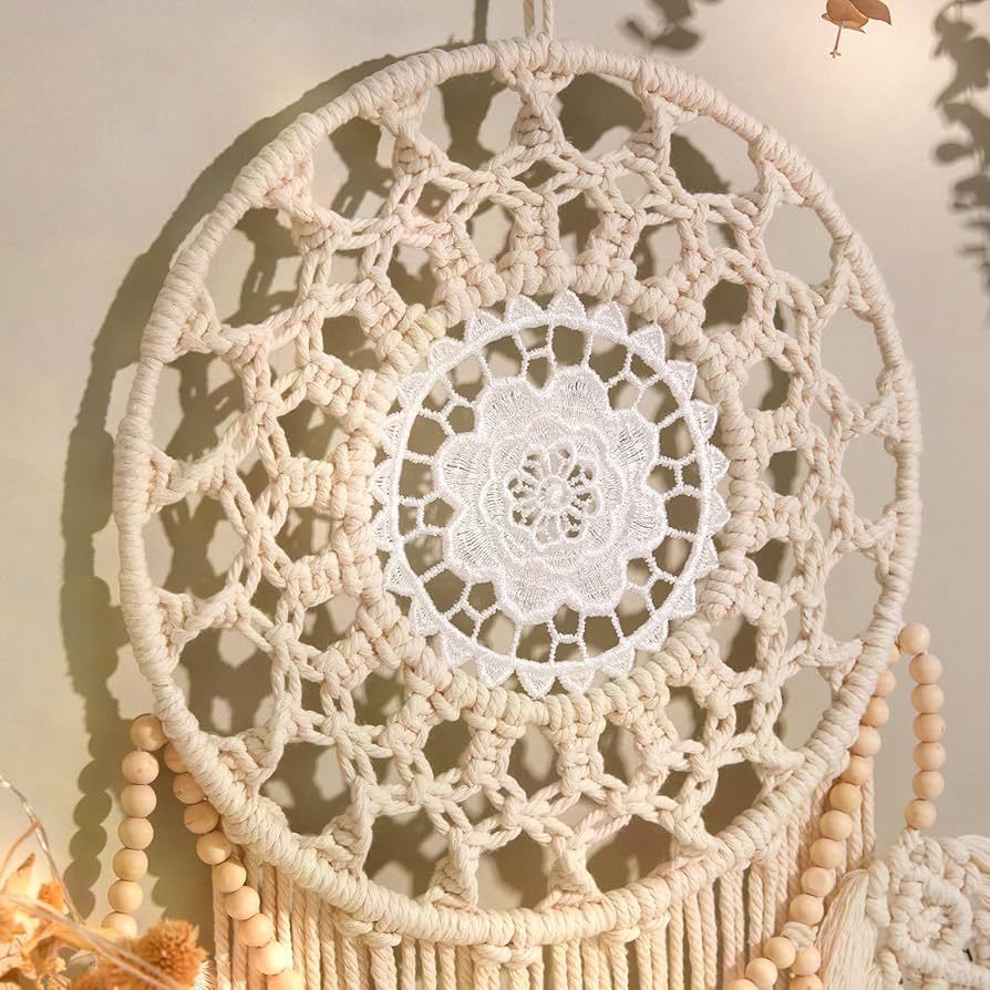 Close-up of the crochet center of the macrame wall hanging showing detailed lace pattern and craftsmanship.
