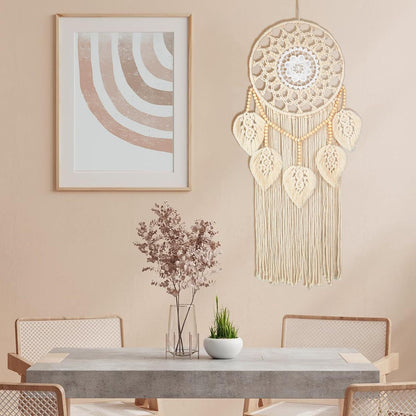 Handwoven macrame wall hanging styled in a minimalist dining room with neutral tones and modern décor.