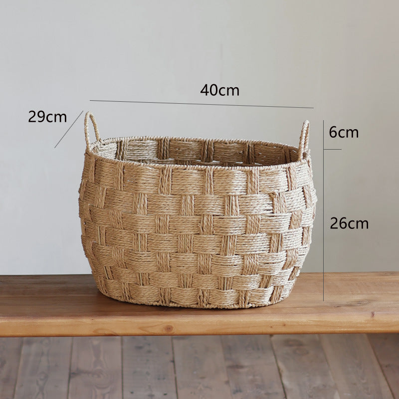 Large handwoven straw basket on wooden table with size measurements displayed in centimeters.