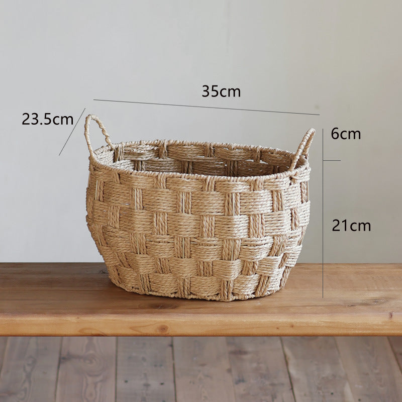 Small handwoven straw basket with labeled dimensions on wooden table surface.