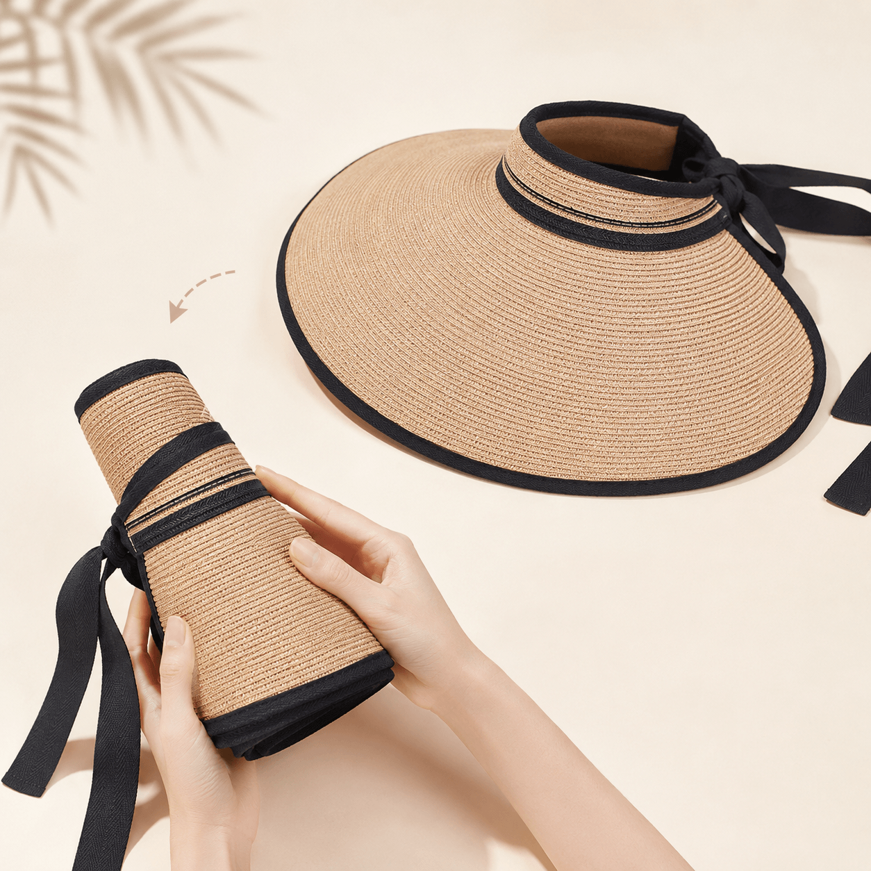 Foldable paper straw visor hat shown flat and rolled with black ribbon tie for easy carrying
