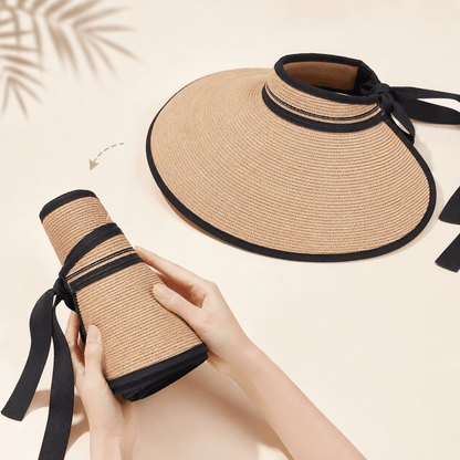 Foldable paper straw visor hat shown flat and rolled with black ribbon tie for easy carrying