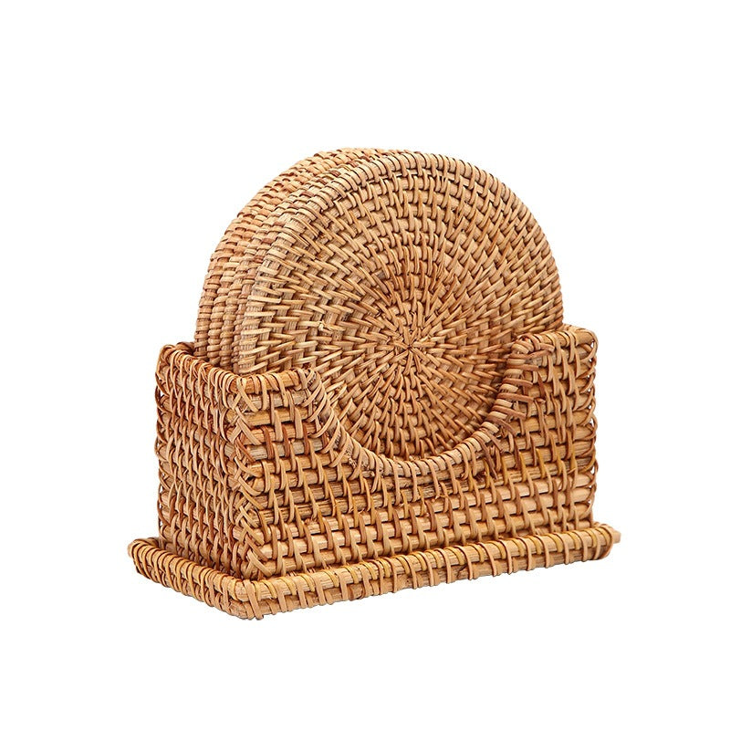 Single handcrafted rattan coaster set with holder, isolated on white background for product display.