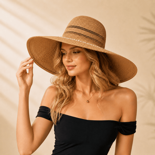  Woman wearing a handwoven openwork wide brim paper straw sun hat in khaki with a black off-shoulder top