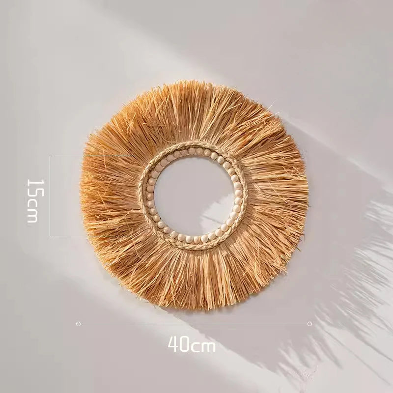 Circular hand-woven raffia straw wall decor with open center and beaded ring design, measuring 40 cm in diameter.