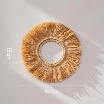 Circular hand-woven raffia straw wall decor with open center and beaded ring design, measuring 40 cm in diameter.