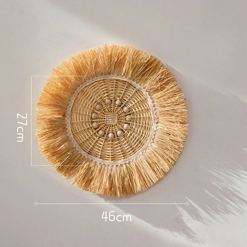 Large woven raffia straw wall decor with radial pattern and natural texture, measuring 46 cm wide.