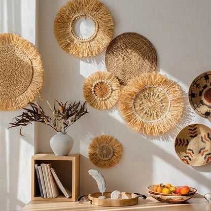 Hand-woven raffia straw wall decorations arranged in a cozy living room with natural light and wooden furniture.