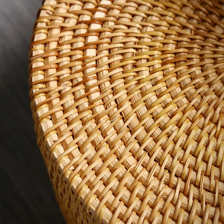 Close-up of woven rattan surface highlighting the natural fibers and tight weaving craftsmanship.