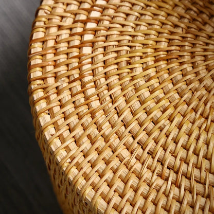 Close-up of woven rattan surface highlighting the natural fibers and tight weaving craftsmanship.