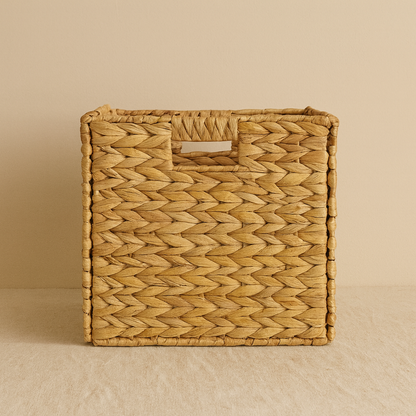 Front view of square water hyacinth basket highlighting woven texture and built-in handle.