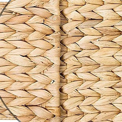 Close-up of handwoven water hyacinth material, showing detailed weaving and natural fiber color.