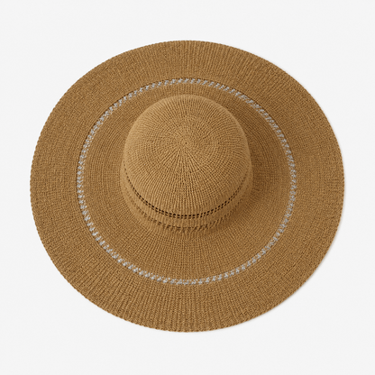 Top view of a khaki openwork wide brim straw sun hat with contrast stitched brim detail