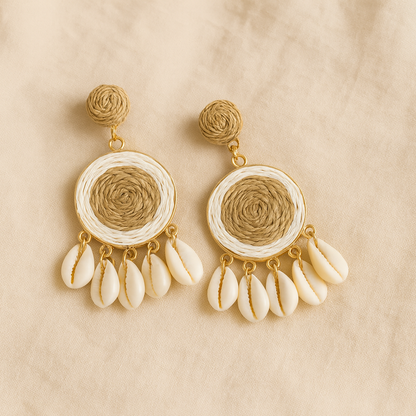 Pair of raffia-woven round shell earrings with natural beige and white tones on linen background.