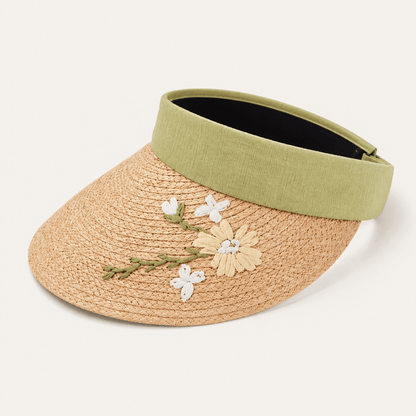 Sage green floral embroidered wide brim straw visor hat for women on a neutral background