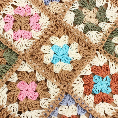 “Detailed view of crochet floral pattern on embroidered straw bag showing multicolor yarn weaving, by Solmerea.”