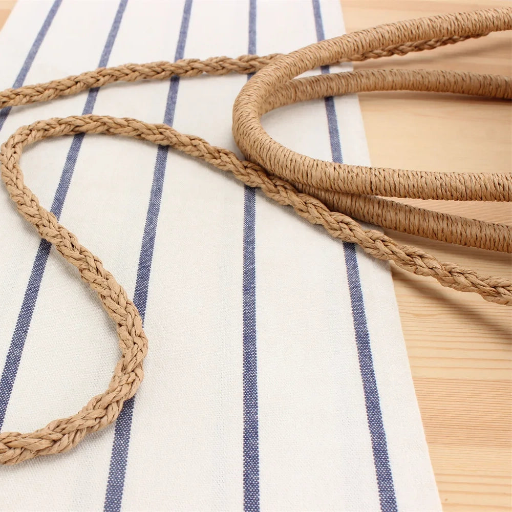 “Detailed view of braided straw shoulder strap highlighting durable weave pattern, by Solmerea.”