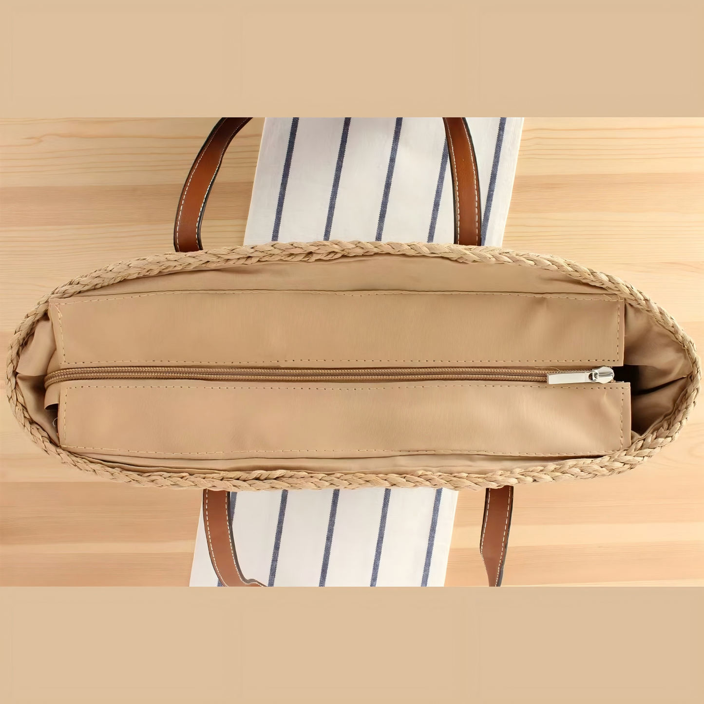 Top view of spacious straw tote with full zip closure and inner pocket organizer, by Solmerea.